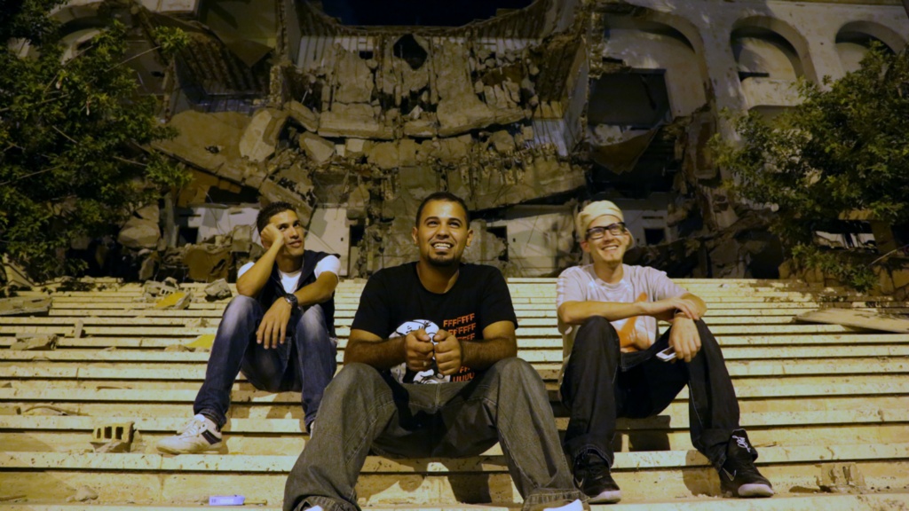 Yusef and his friends outside an old hotel